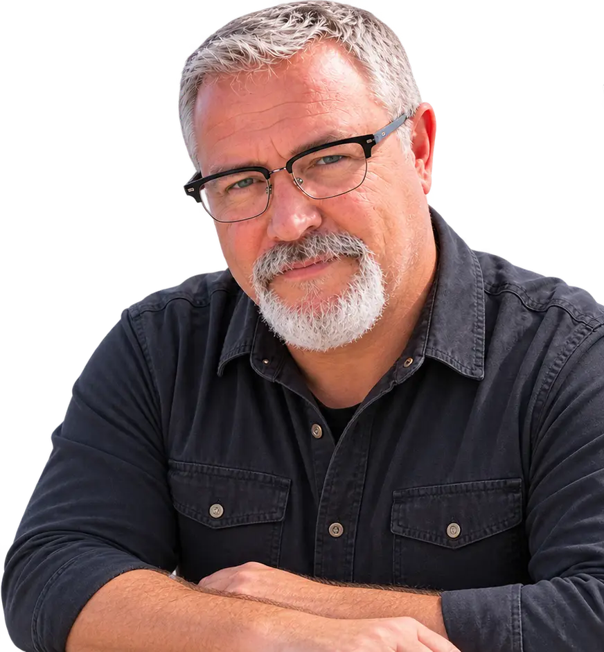 Jon Robertson, arms folded, looking directly at the camera